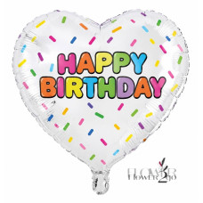 A foil balloon with the message “happy birthday”.